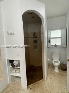 101 Southwest 101st Terrace, Unit 101 Plantation, FL 33324 - Photo 13 of 15 a bathroom with a toilet and a shower