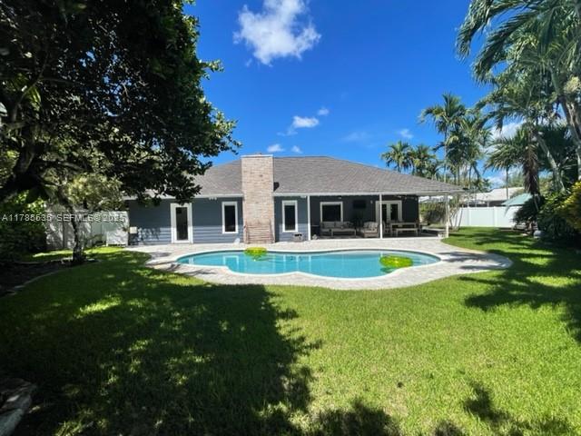 101 Southwest 101st Terrace, Unit 101 Plantation, FL 33324 - Photo 2 of 15 a front view of a house with swimming pool having outdoor seating