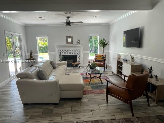 101 Southwest 101st Terrace, Unit 101 Plantation, FL 33324 - Photo 4 of 15 a living room with furniture and a flat screen tv