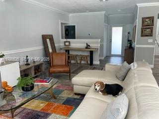 101 Southwest 101st Terrace, Unit 101 Plantation, FL 33324 - Photo 5 of 15 a living room with furniture and a flat screen tv