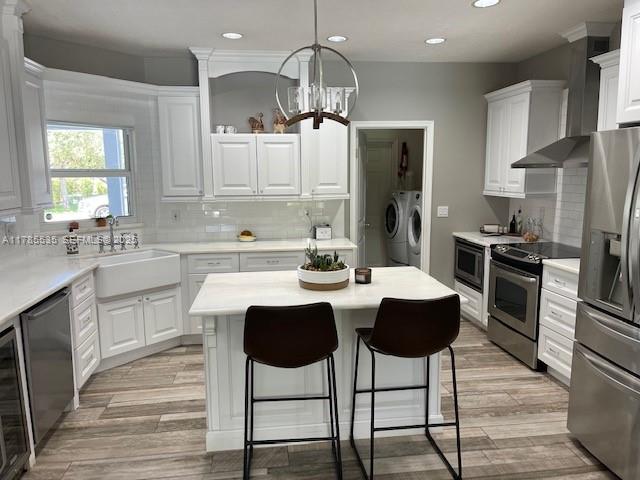 101 Southwest 101st Terrace, Unit 101 Plantation, FL 33324 - Photo 7 of 15 a kitchen with a dining table chairs stainless steel appliances and cabinets