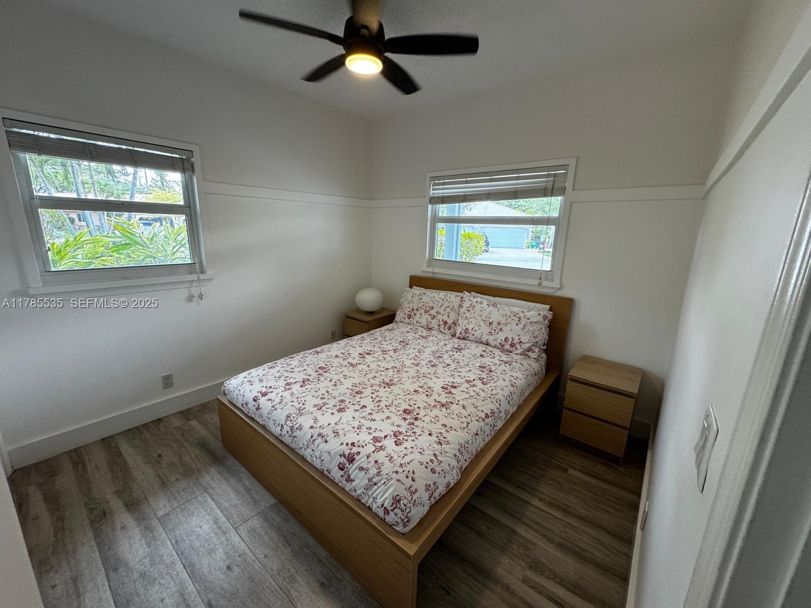 101 Southwest 101st Terrace, Unit 101 Plantation, FL 33324 - Photo 10 of 15 a bed sitting in a bedroom next to a window