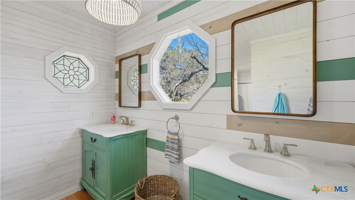 3781 Ridgeway Drive San Antonio, TX 78259 - Photo 13 of 44 a bathroom with a sink and a mirror