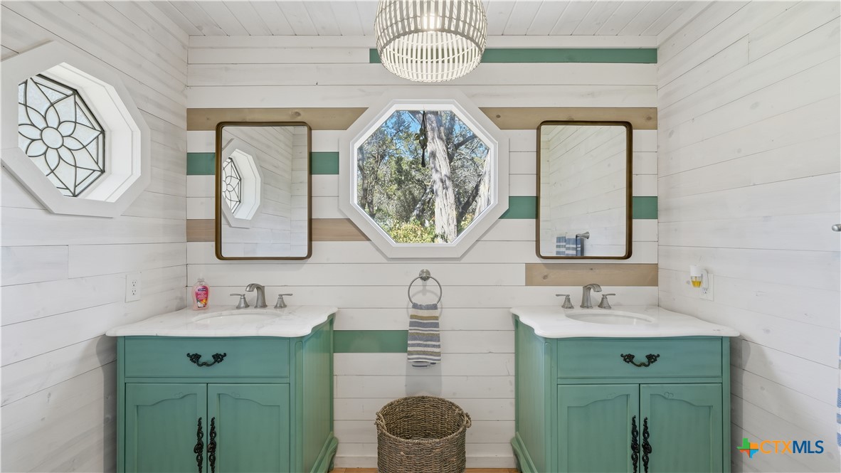 3781 Ridgeway Drive San Antonio, TX 78259 - Photo 14 of 44 a bathroom with a sink and a mirror