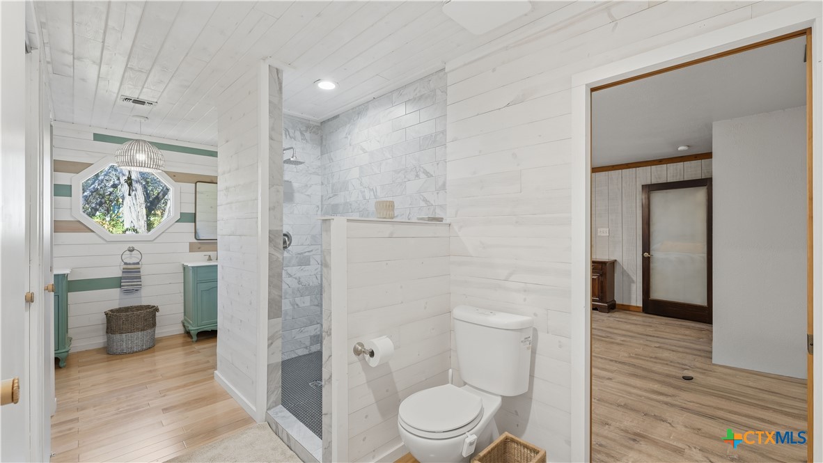 3781 Ridgeway Drive San Antonio, TX 78259 - Photo 16 of 44 a bathroom with a toilet a sink and shower