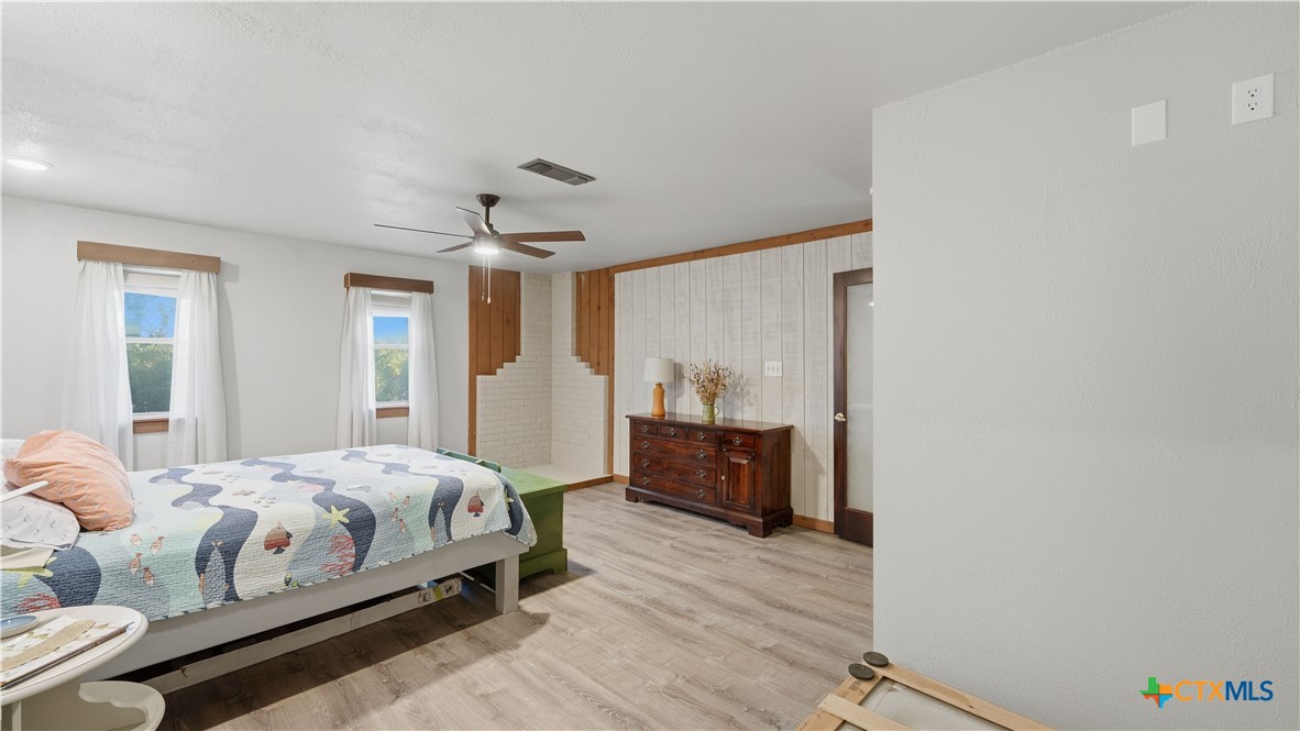 3781 Ridgeway Drive San Antonio, TX 78259 - Photo 18 of 44 a bedroom with a bed and a dresser