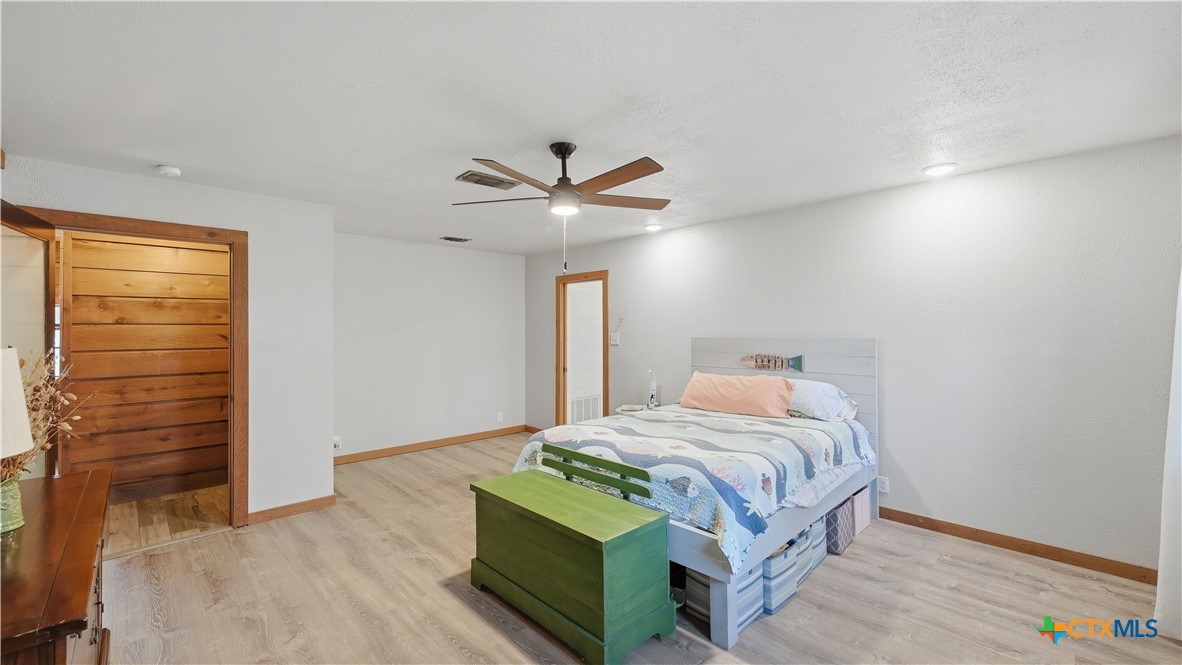 3781 Ridgeway Drive San Antonio, TX 78259 - Photo 20 of 44 a bedroom with a bed and a ceiling fan
