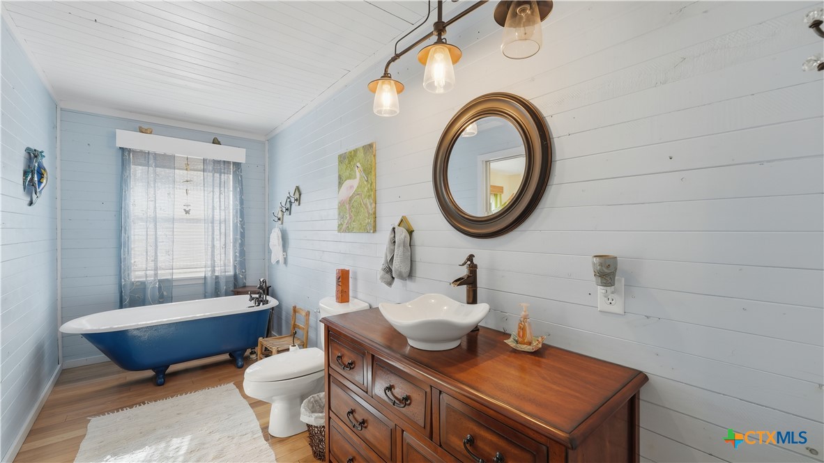 3781 Ridgeway Drive San Antonio, TX 78259 - Photo 29 of 44 a bathroom with a blue sink and a mirror