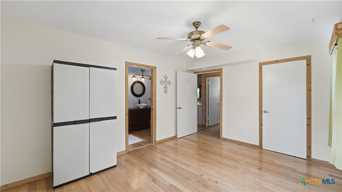 3781 Ridgeway Drive San Antonio, TX 78259 - Photo 30 of 44 a view of a kitchen with a refrigerator and wooden floor