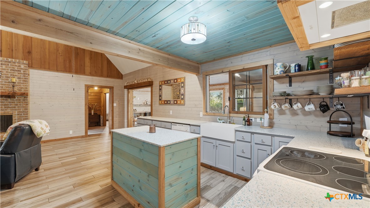 3781 Ridgeway Drive San Antonio, TX 78259 - Photo 35 of 44 a large room with stainless steel appliances granite countertop a sink and wooden floors