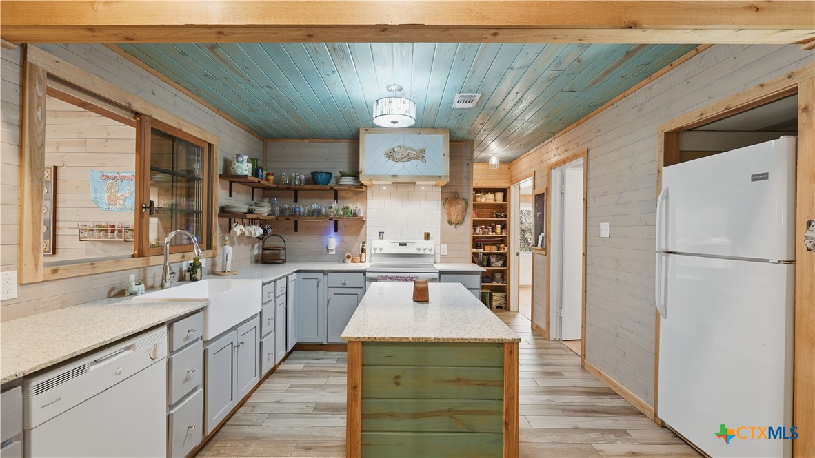 3781 Ridgeway Drive San Antonio, TX 78259 - Photo 36 of 44 a kitchen with a stove a refrigerator and a sink