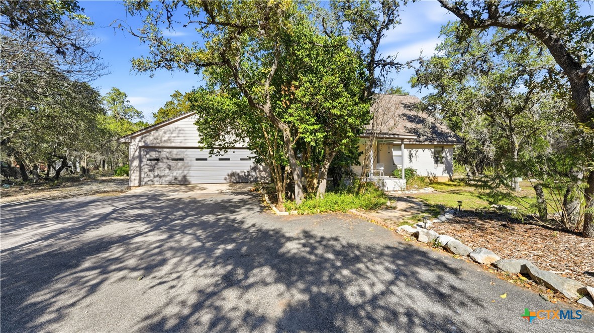 3781 Ridgeway Drive San Antonio, TX 78259 - Photo 6 of 44 a view of a road with plants and large trees