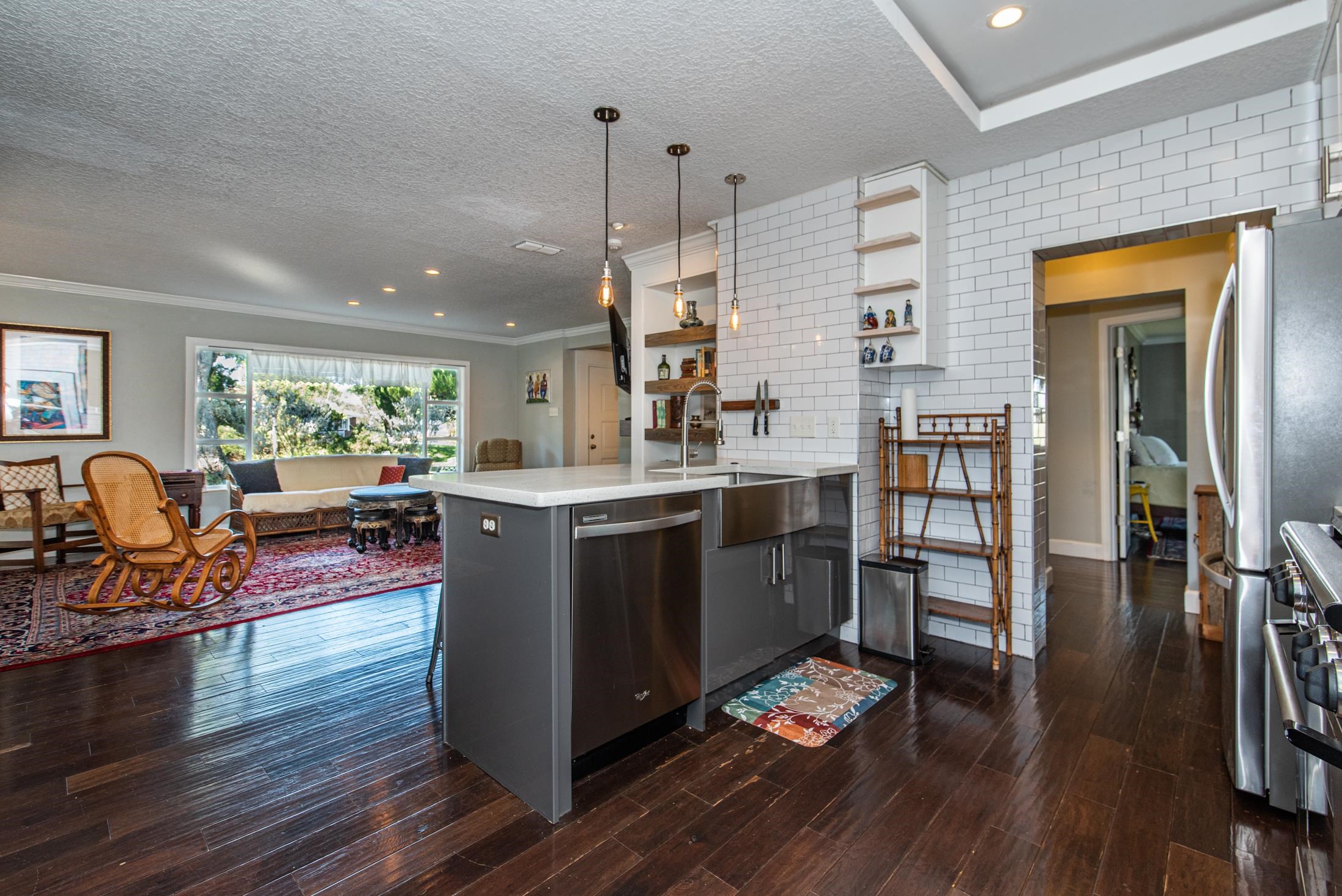 134 Neptune Road St. Augustine, FL 32086 - Photo 14 of 36 a kitchen with stainless steel appliances granite countertop a stove and wooden floor