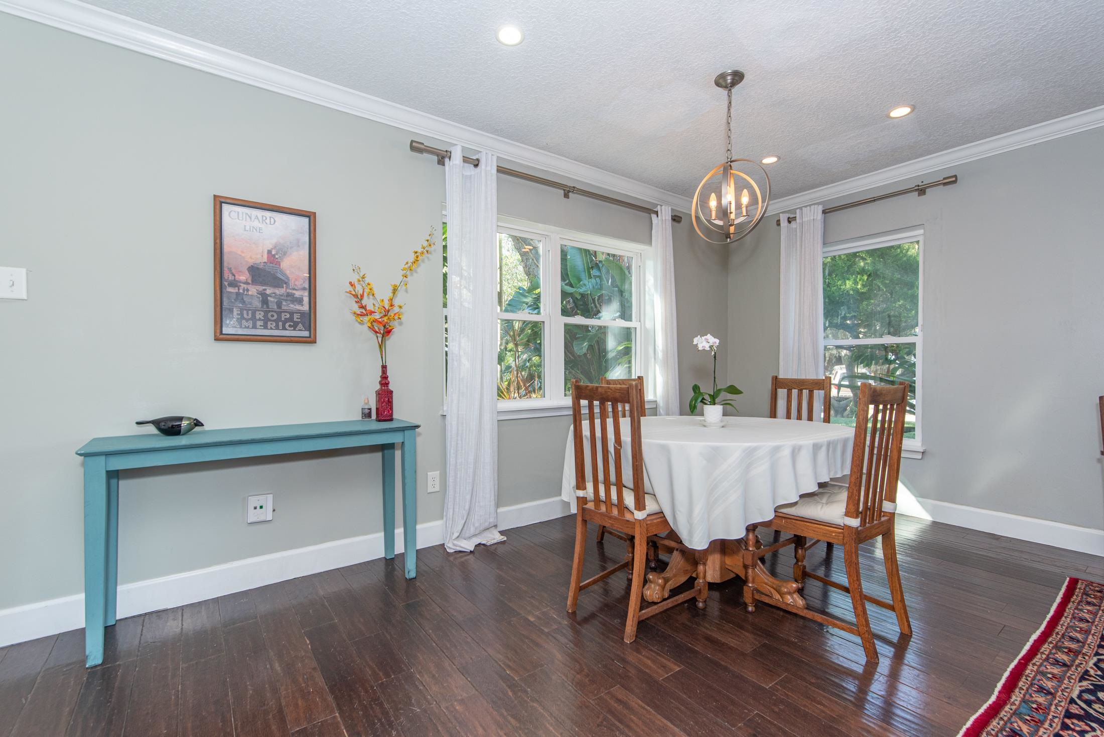 134 Neptune Road St. Augustine, FL 32086 - Photo 15 of 36 a view of a dining room with furniture window and wooden floor
