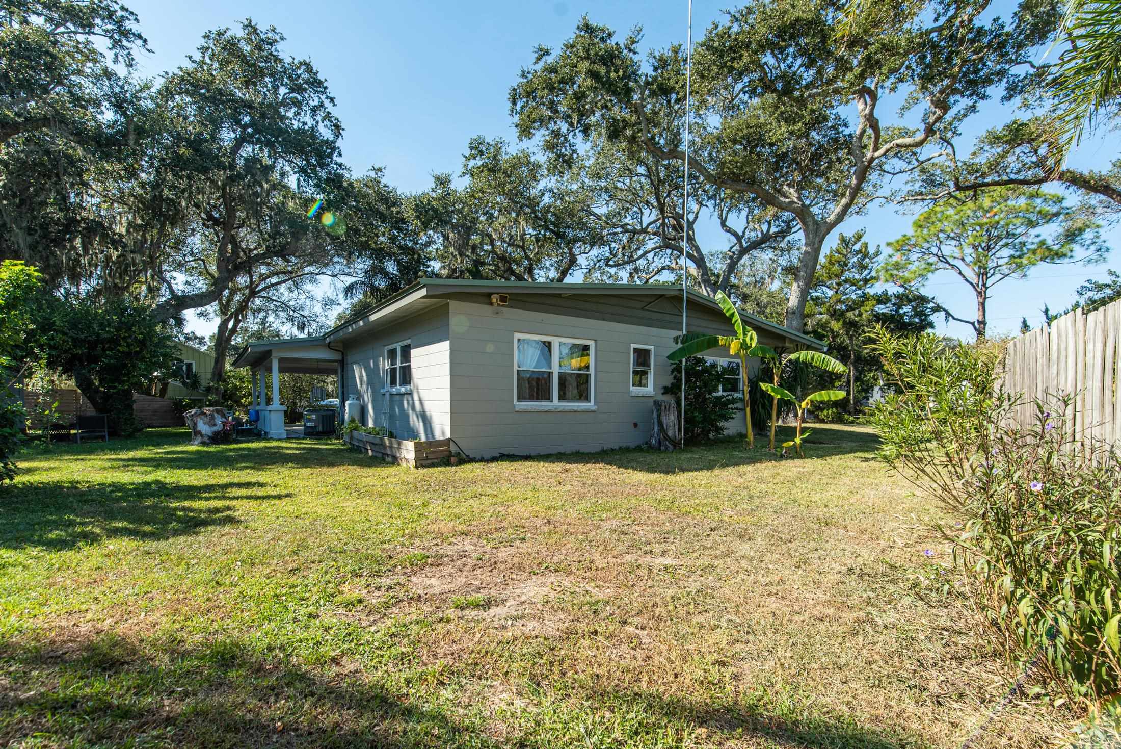 134 Neptune Road St. Augustine, FL 32086 - Photo 29 of 36 a house with trees in the background