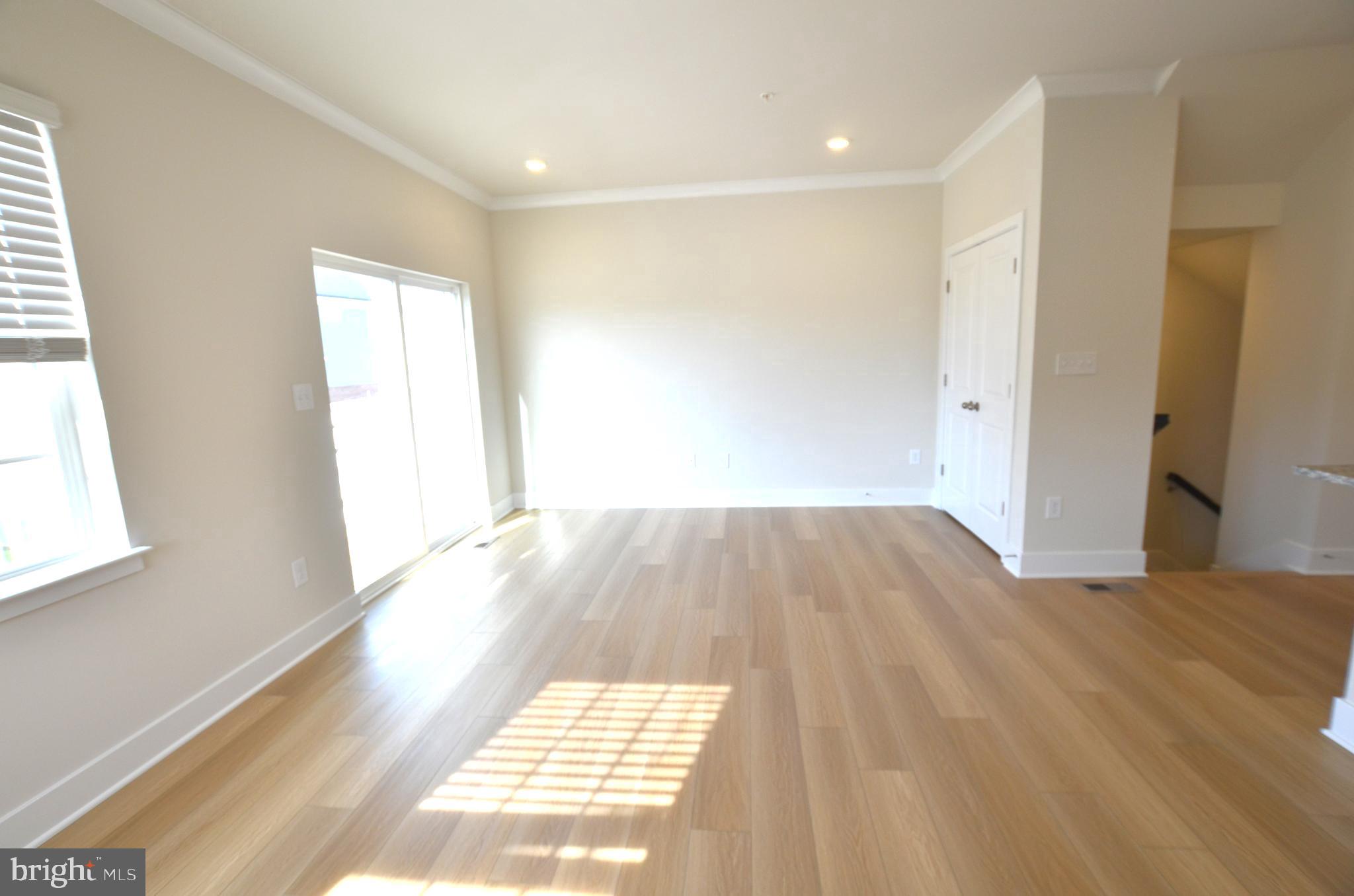 1832 Parham Way Baltimore, MD 21244 - Photo 11 of 25 a view of a room with wooden floor and a window