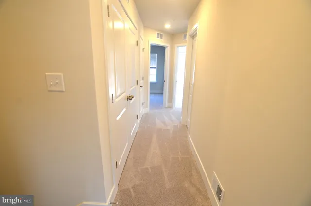 a view of a bathroom from the hallway