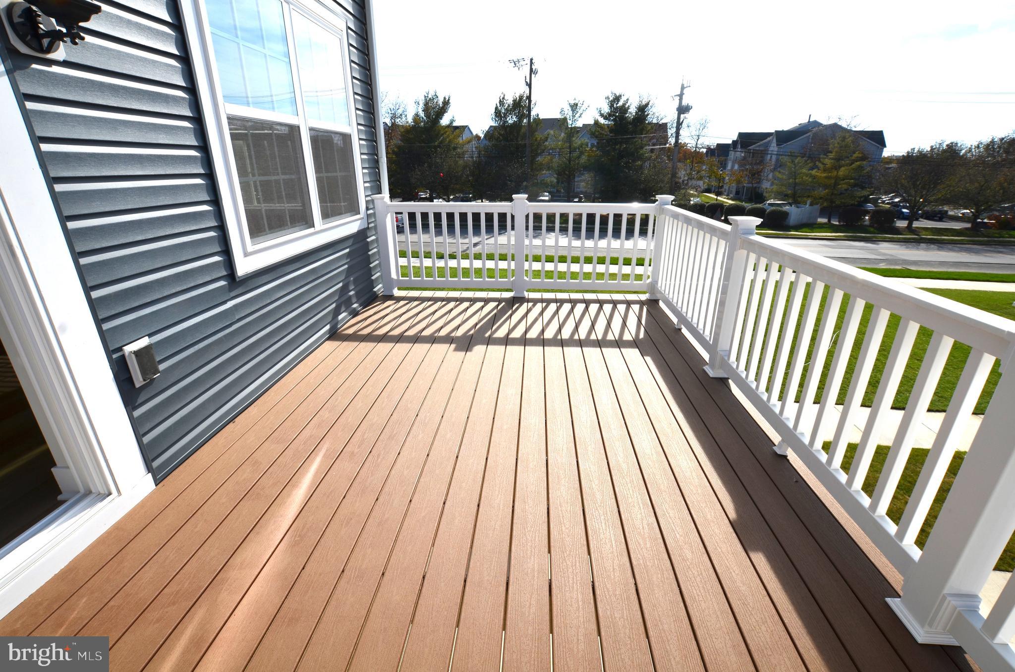 1832 Parham Way Baltimore, MD 21244 - Photo 22 of 25 a view of balcony with wooden floor and fence