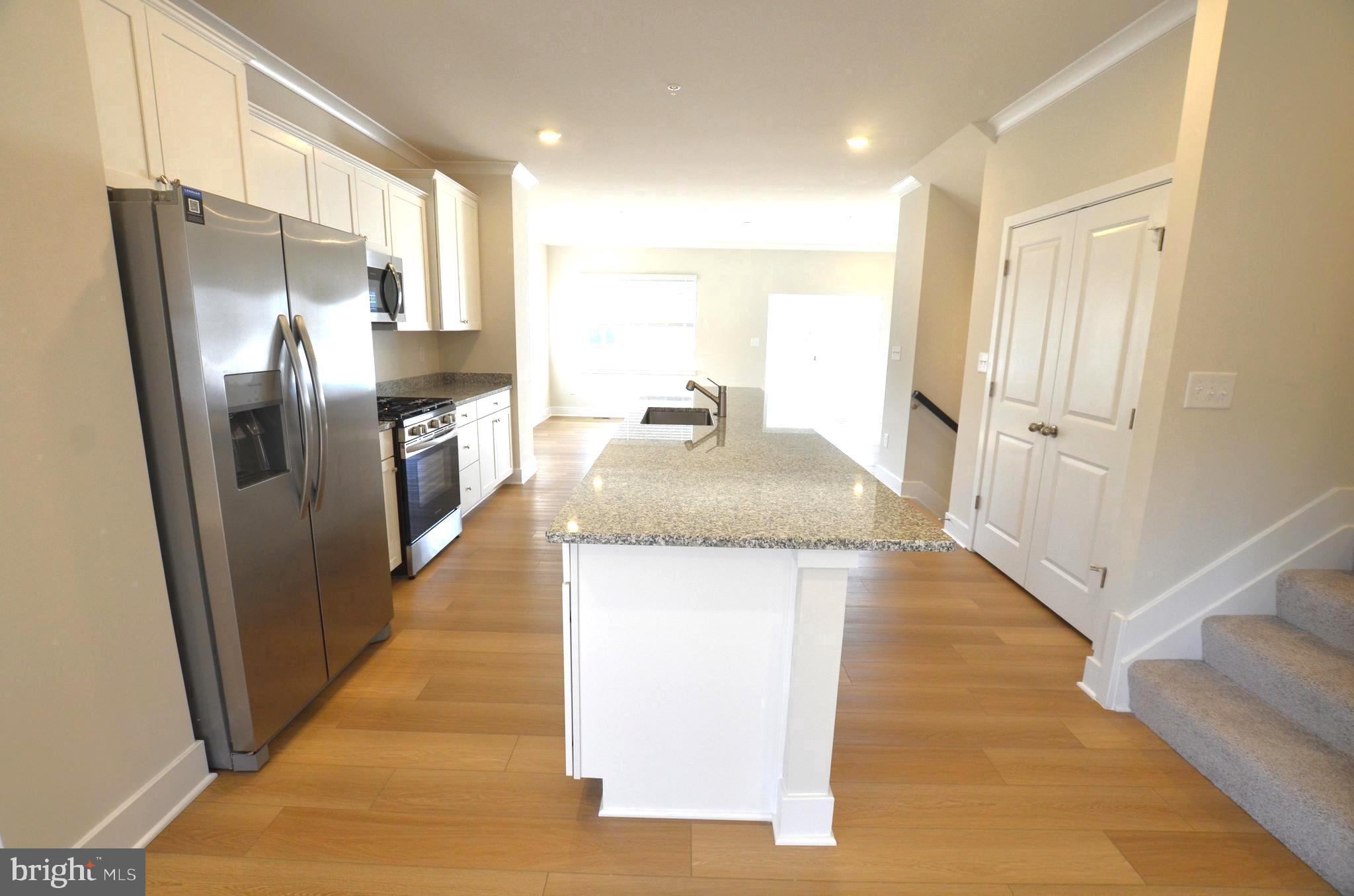 1832 Parham Way Baltimore, MD 21244 - Photo 8 of 25 a kitchen with stainless steel appliances granite countertop a refrigerator and a sink
