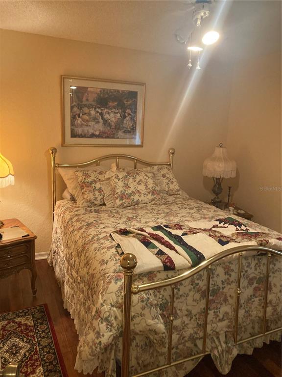 8744 Southwest 108th Ln Road Ocala, FL 34481 - Photo 9 of 28 a bed sitting in a bedroom next to a window