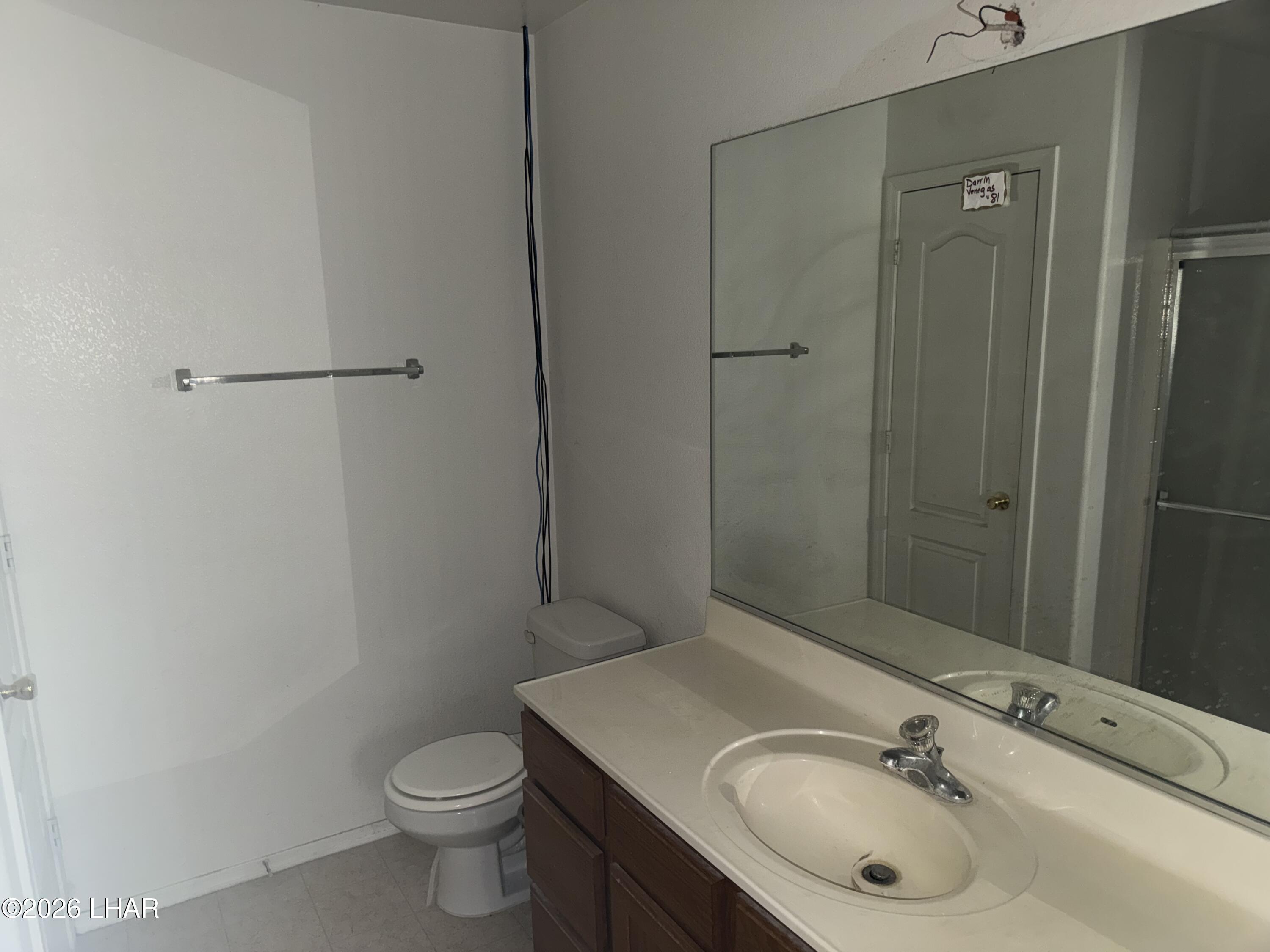 4897 South Rinaldi Drive Fort Mohave, AZ 86426 - Photo 15 of 22 a bathroom with a sink toilet and shower