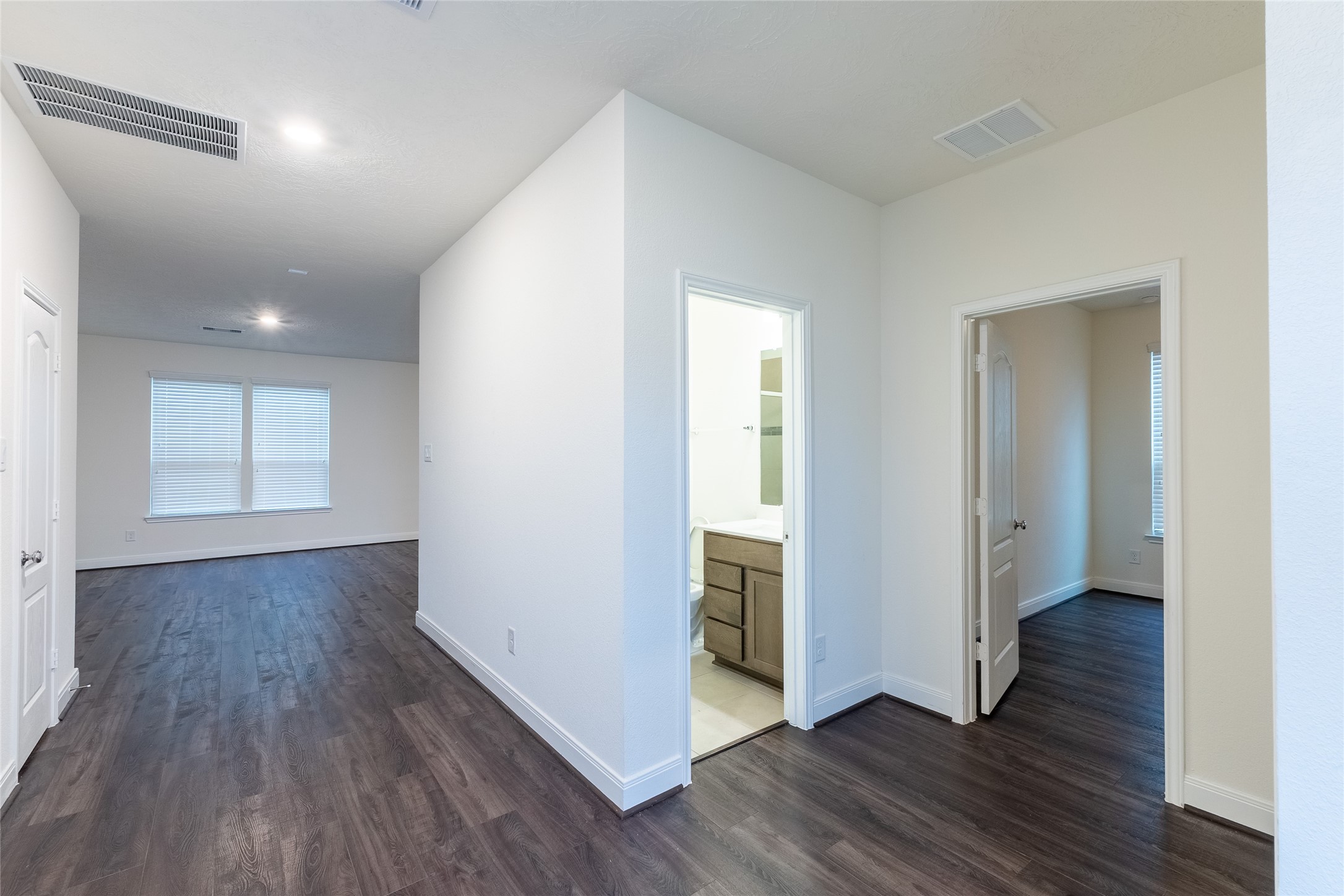27646 Mesabe Drive Magnolia, TX 77354 - Photo 14 of 24 an empty room with wooden floor and windows