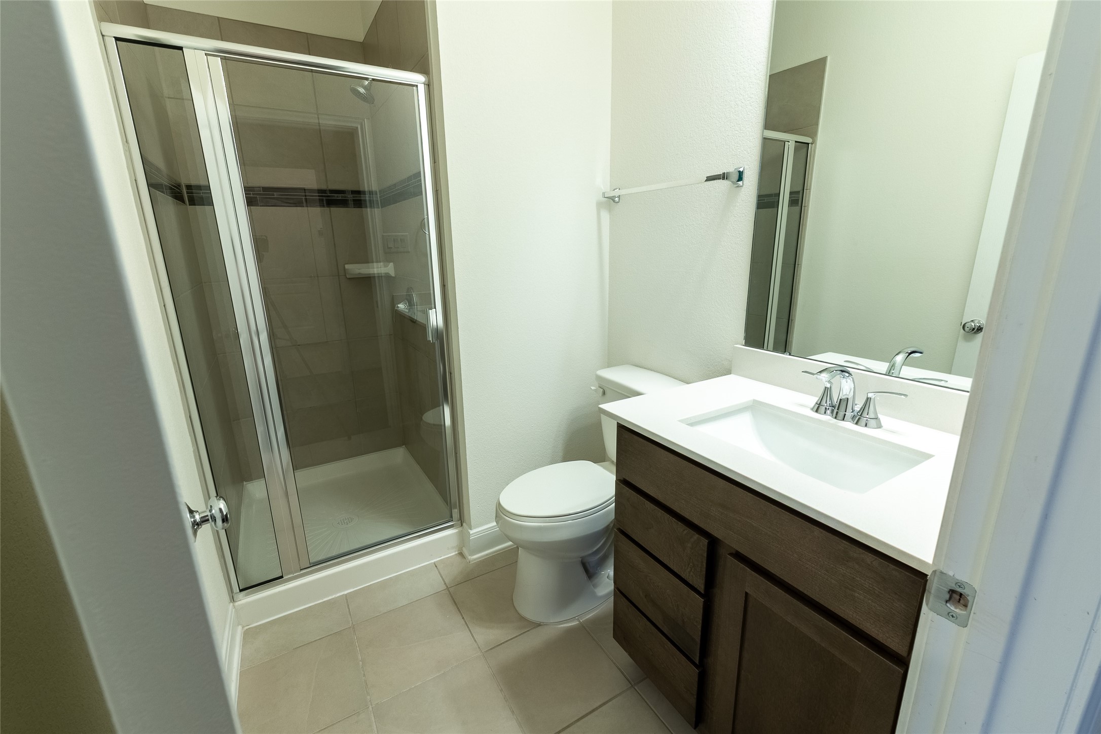 27646 Mesabe Drive Magnolia, TX 77354 - Photo 16 of 24 a bathroom with a shower sink vanity and toilet