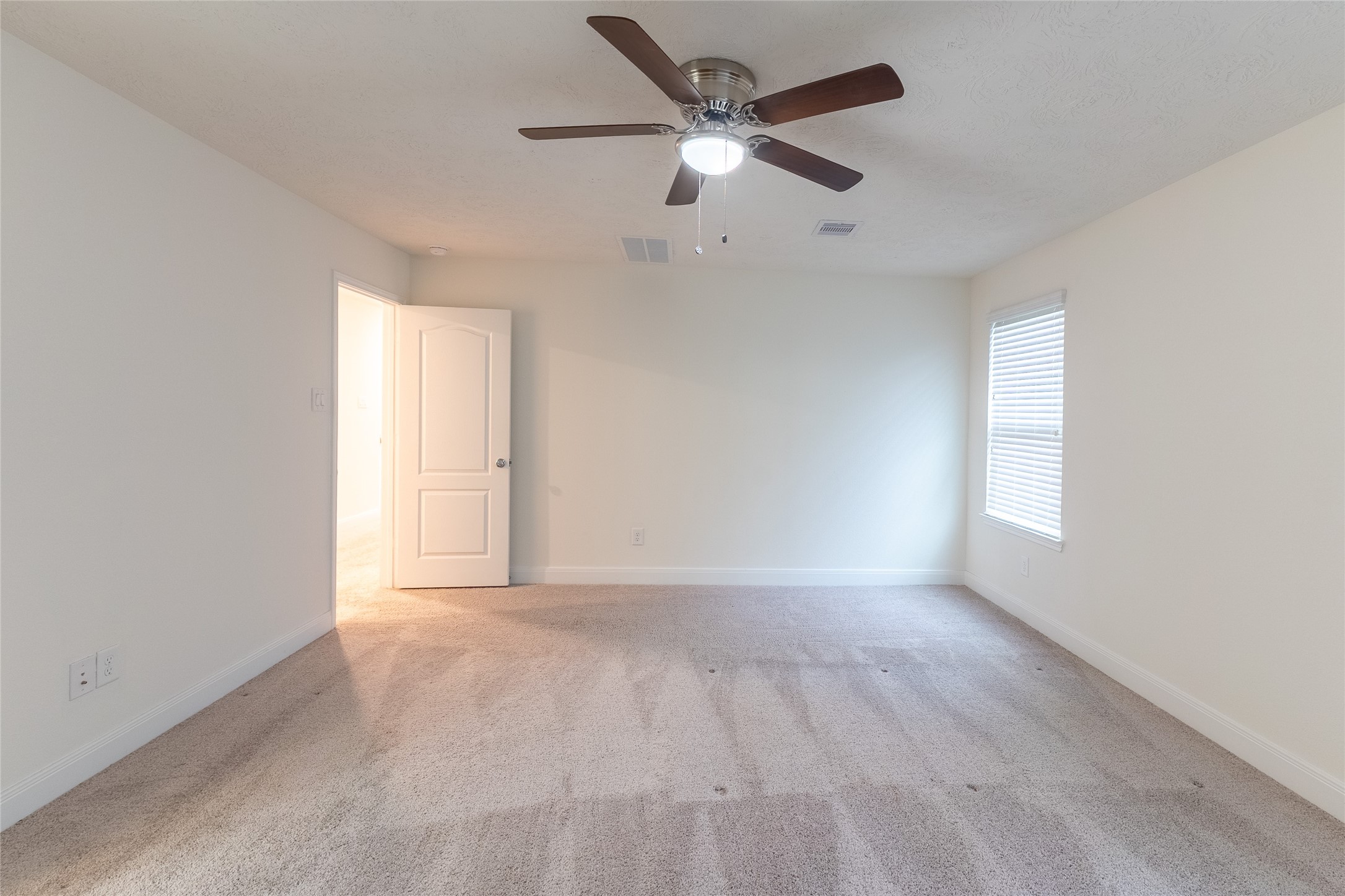 27646 Mesabe Drive Magnolia, TX 77354 - Photo 19 of 24 an empty room with an empty space and a ceiling fan