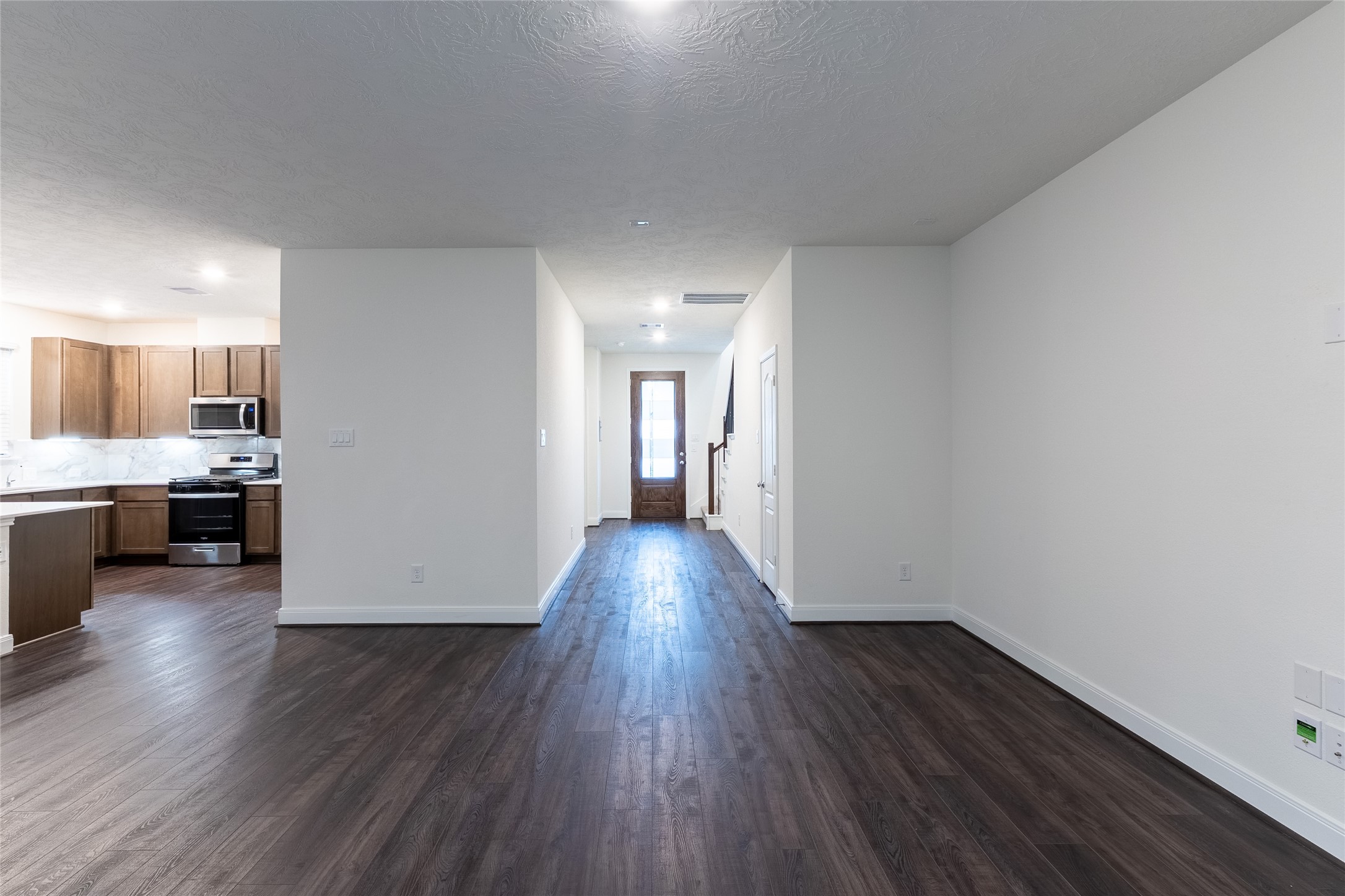 27646 Mesabe Drive Magnolia, TX 77354 - Photo 4 of 24 a view of a kitchen with wooden floor and electronic appliances