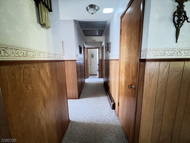 15 Luff Road Boonton, NJ 07005 - Photo 14 of 43 a hallway with wooden cabinets