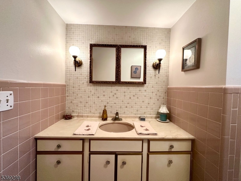 15 Luff Road Boonton, NJ 07005 - Photo 16 of 43 a bathroom with a sink a toilet and mirror