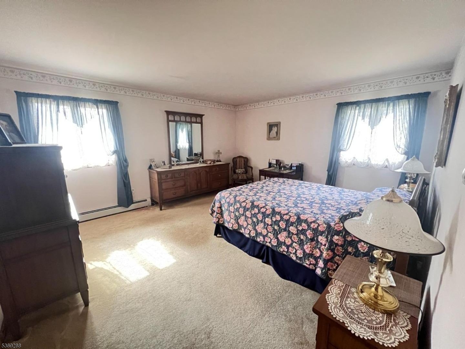 15 Luff Road Boonton, NJ 07005 - Photo 21 of 43 a bedroom with a bed and dresser with mirror