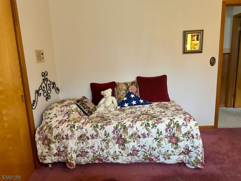 15 Luff Road Boonton, NJ 07005 - Photo 24 of 43 a bedroom with a bed and wooden floor