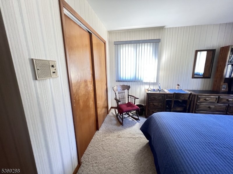 15 Luff Road Boonton, NJ 07005 - Photo 26 of 43 a bed room with a bed and a mirror