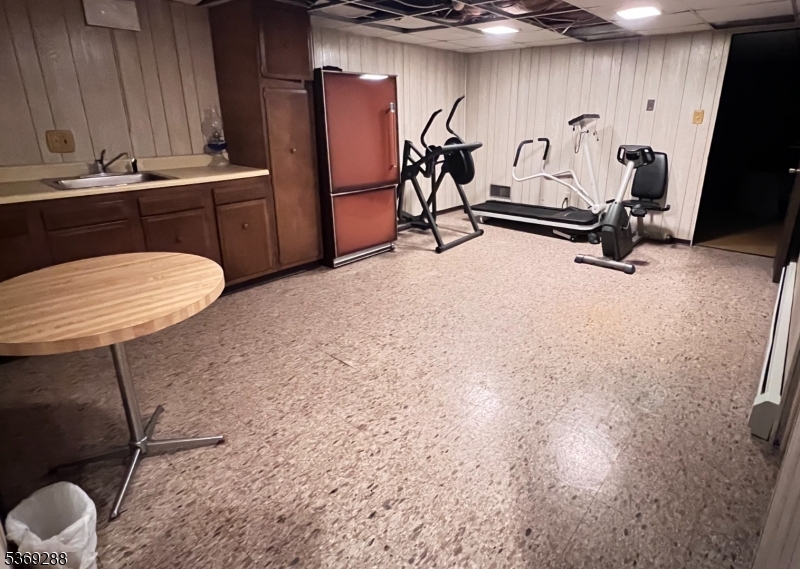 15 Luff Road Boonton, NJ 07005 - Photo 40 of 43 a room with gym equipment and a table