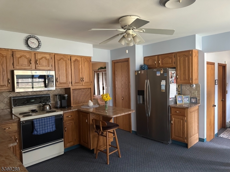 15 Luff Road Boonton, NJ 07005 - Photo 4 of 43 a kitchen with stainless steel appliances a stove a refrigerator and cabinets