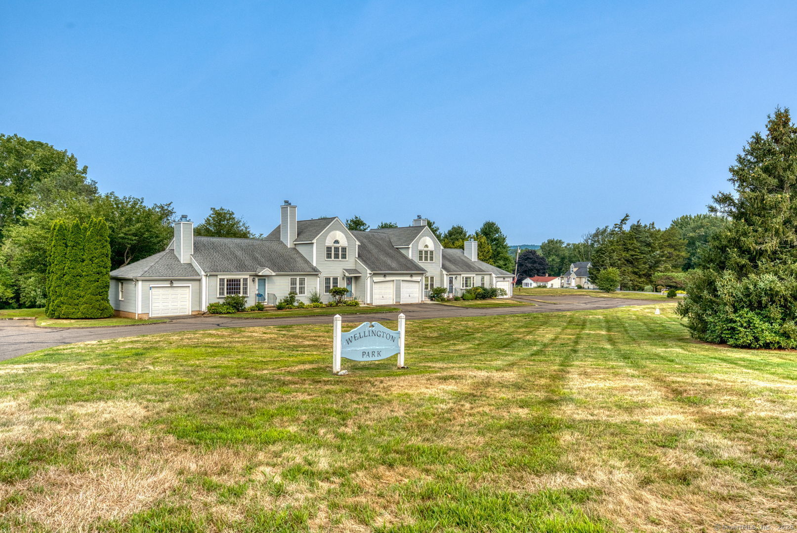 a view of a houses with swimming pool and a yard