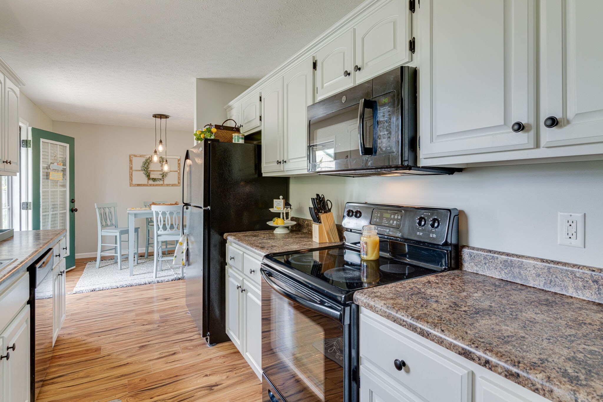 220 Old Martin Chapel Road Portland, TN 37148 - Photo 11 of 31 a kitchen with stainless steel appliances granite countertop a stove a refrigerator and a microwave