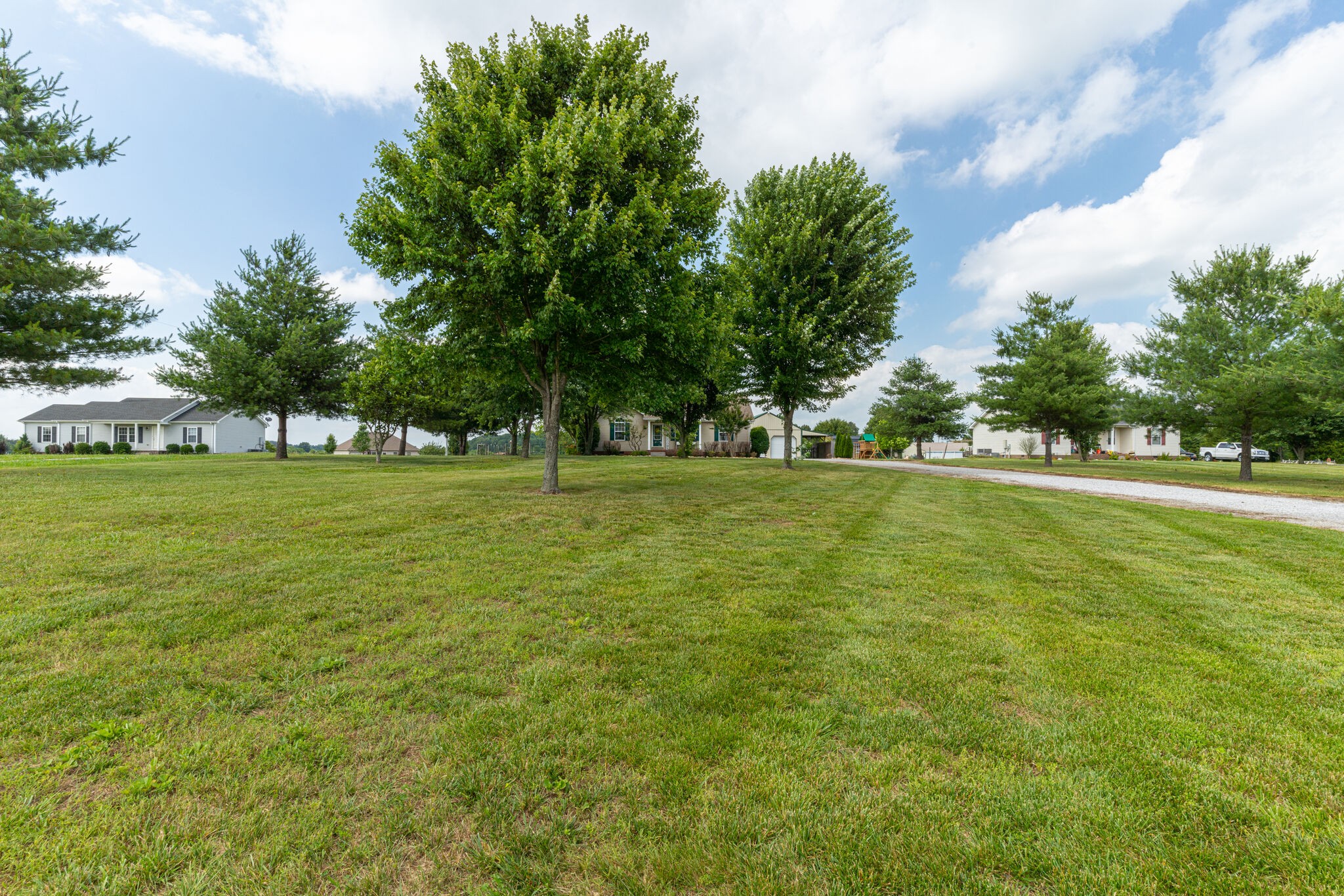 220 Old Martin Chapel Road Portland, TN 37148 - Photo 30 of 31 a view of a green field with trees in the background