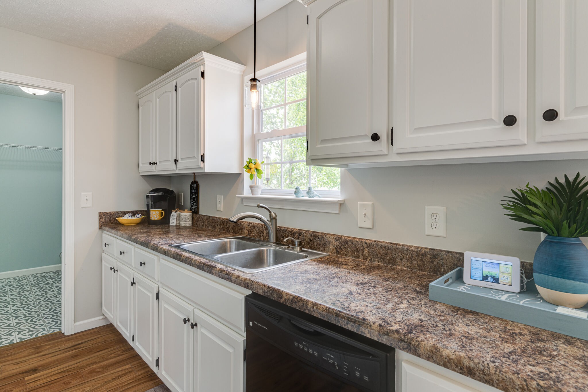 220 Old Martin Chapel Road Portland, TN 37148 - Photo 10 of 31 a kitchen with granite countertop a sink white cabinets and white appliances