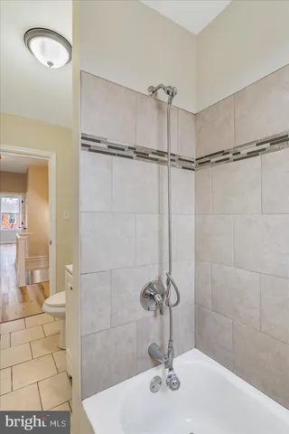 a bathroom with a sink and shower