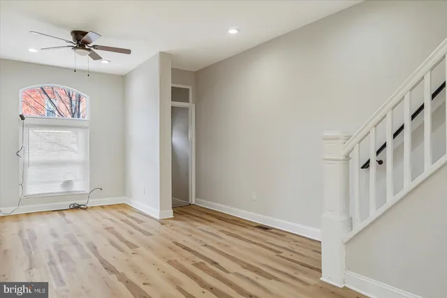 a view of an empty room with a window