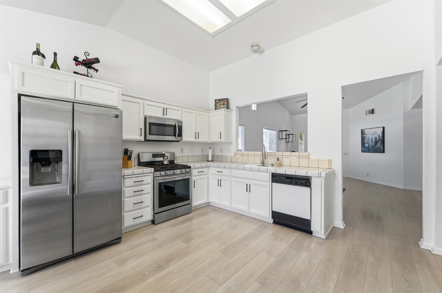 1933 Lifetime Drive Modesto, CA 95355 - Photo 11 of 38 a kitchen with a refrigerator stove and sink