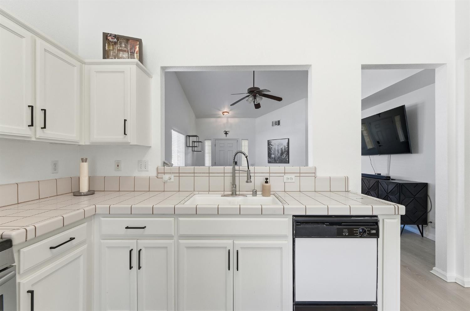 1933 Lifetime Drive Modesto, CA 95355 - Photo 12 of 38 a kitchen with granite countertop a sink a stove and cabinets