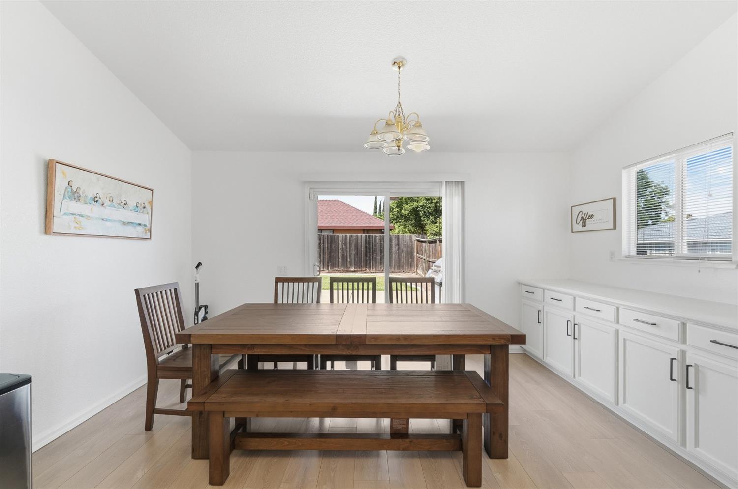 1933 Lifetime Drive Modesto, CA 95355 - Photo 14 of 38 a view of a dining room with furniture window and wooden floor