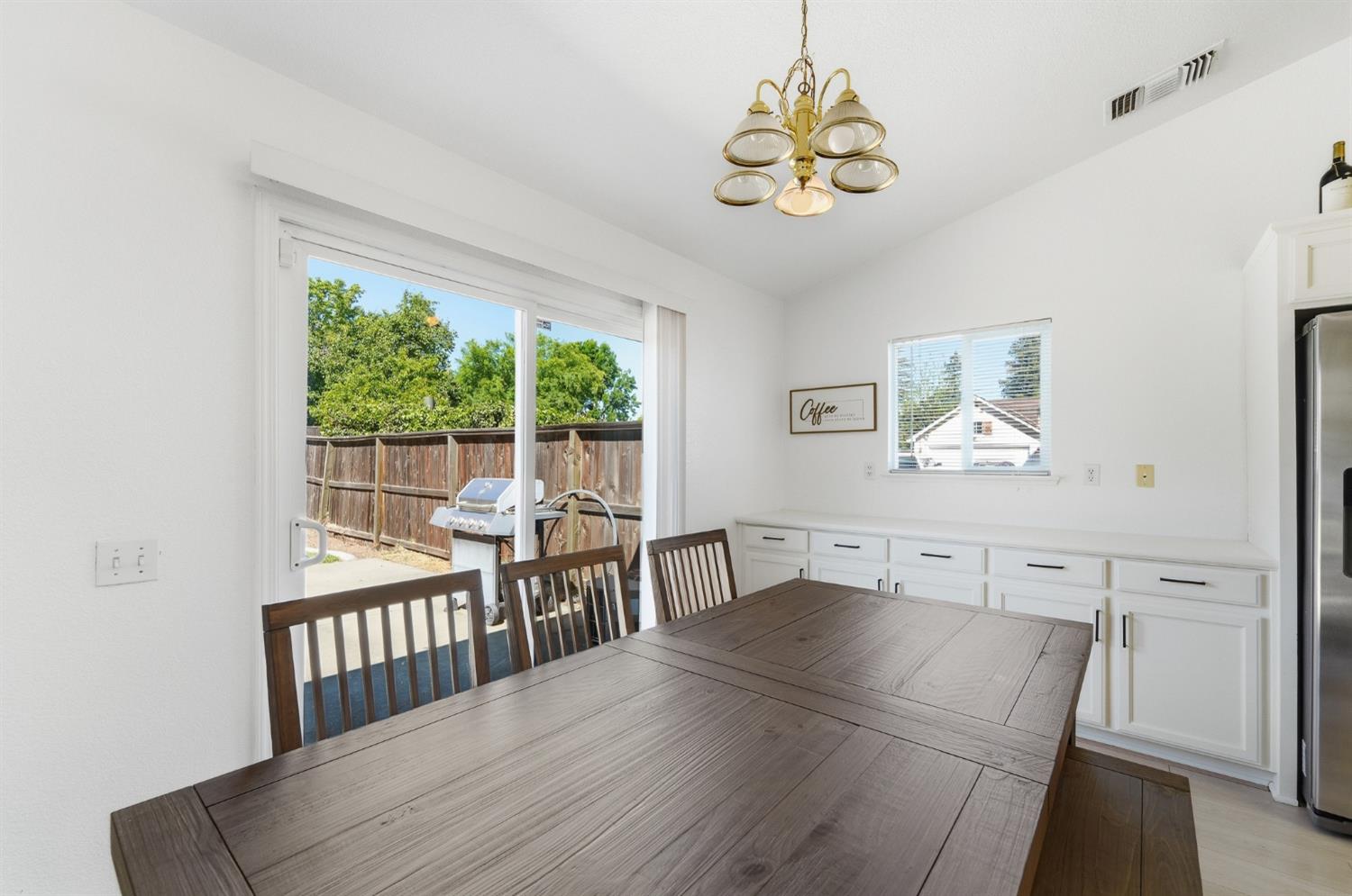 1933 Lifetime Drive Modesto, CA 95355 - Photo 15 of 38 a view of a dining room with furniture window and outside view