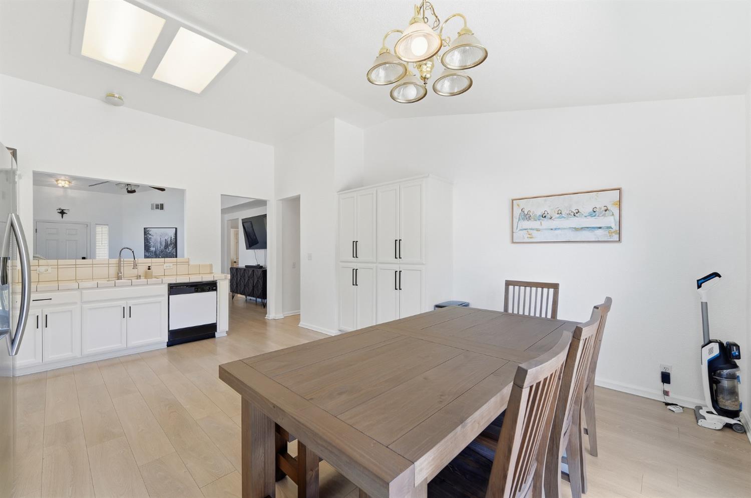 1933 Lifetime Drive Modesto, CA 95355 - Photo 16 of 38 a view of a dining room with furniture and wooden floor