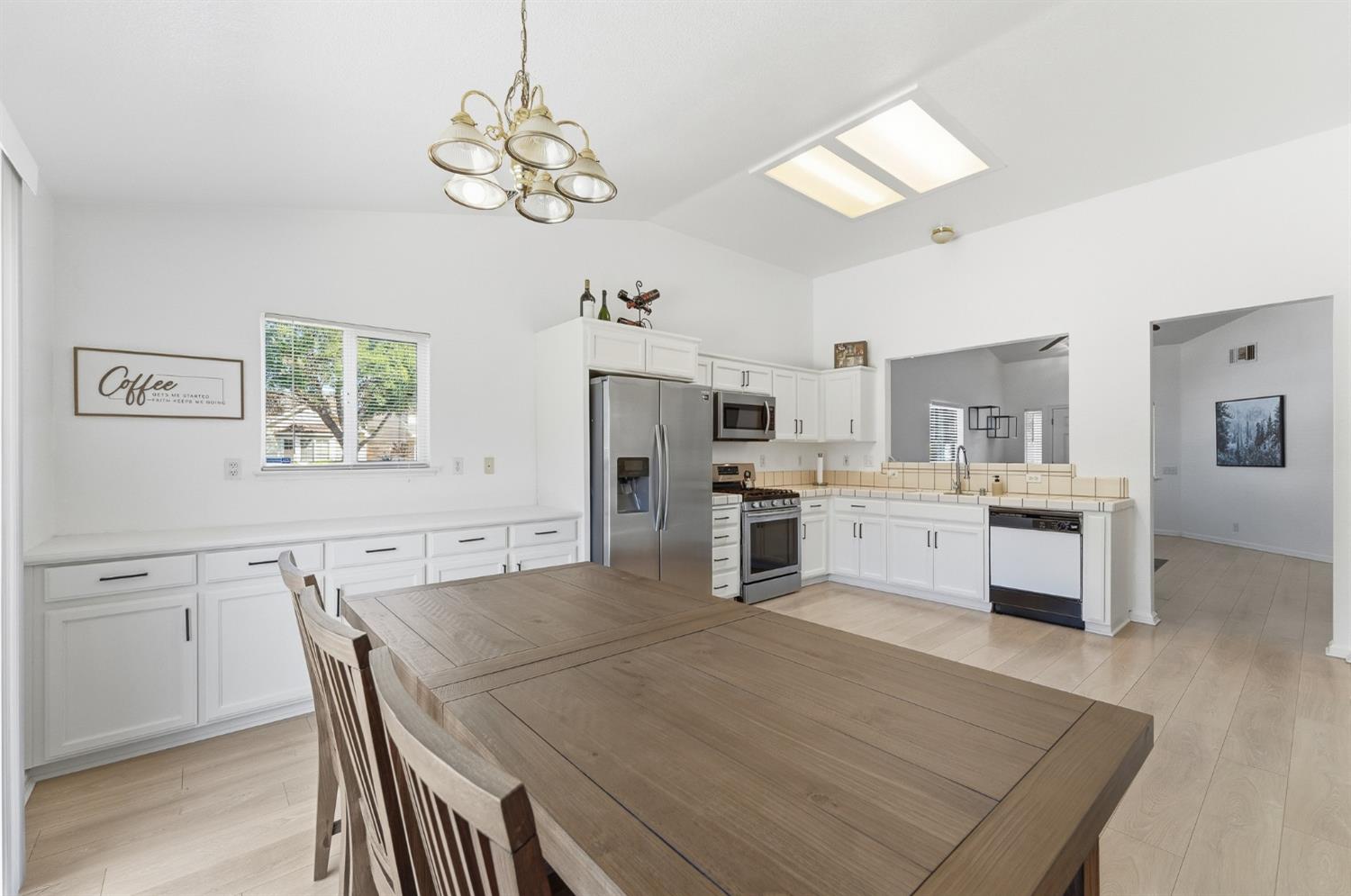 1933 Lifetime Drive Modesto, CA 95355 - Photo 17 of 38 a kitchen with white cabinets and stainless steel appliances