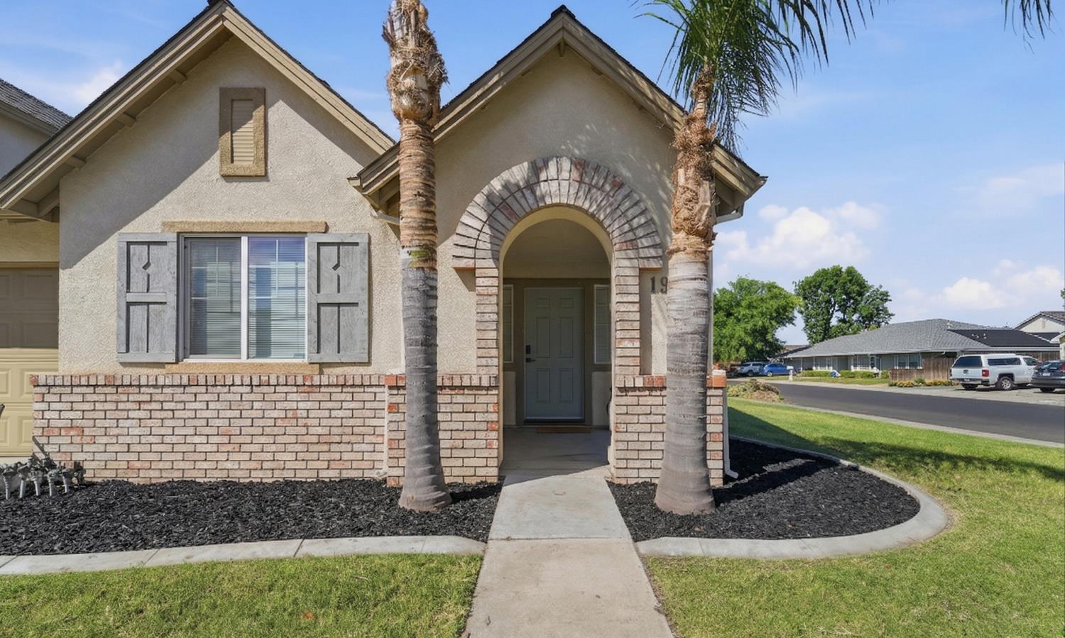 1933 Lifetime Drive Modesto, CA 95355 - Photo 2 of 38 a front view of a house with garden