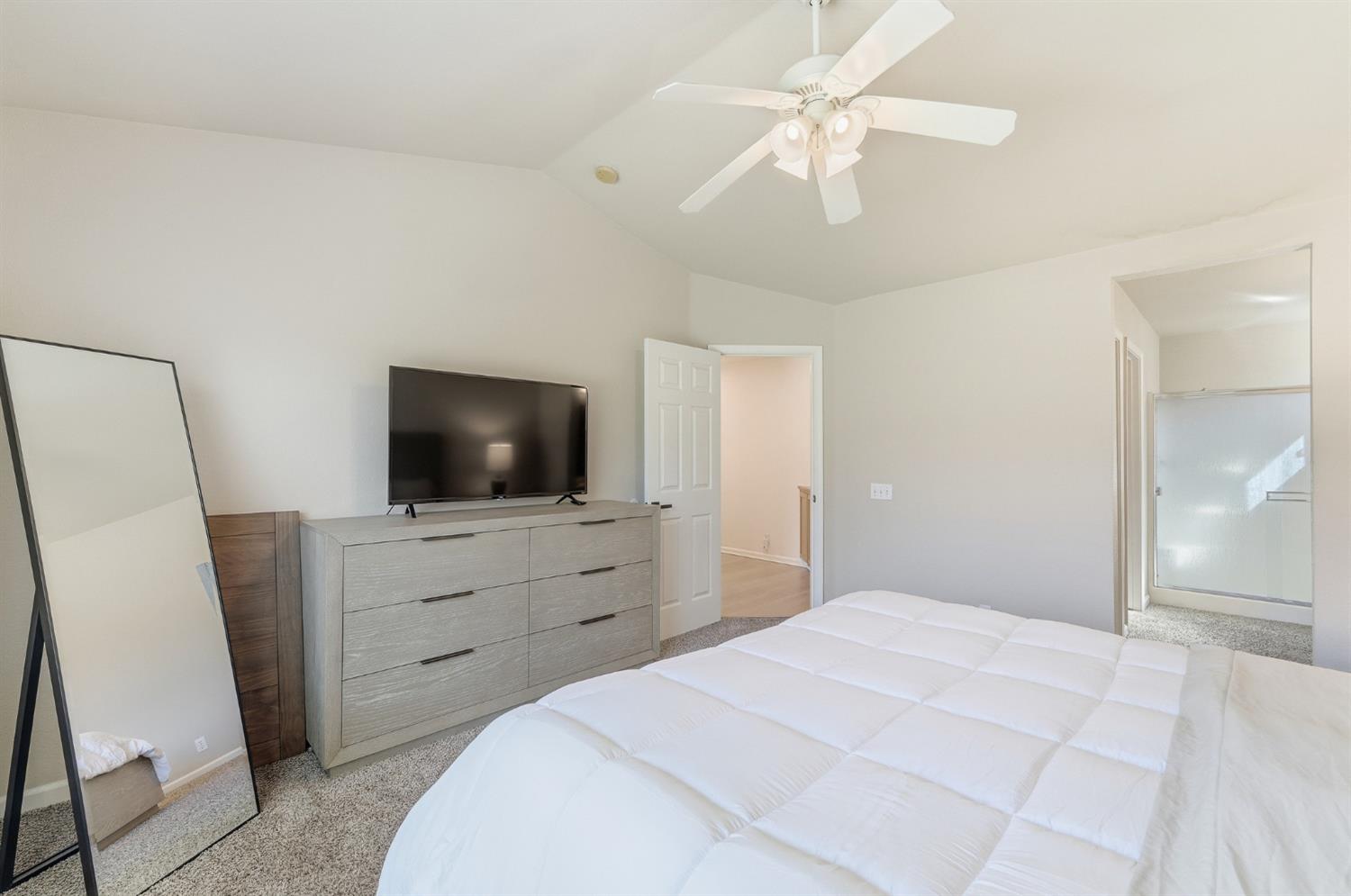 1933 Lifetime Drive Modesto, CA 95355 - Photo 22 of 38 a bedroom with a bed and a flat screen tv